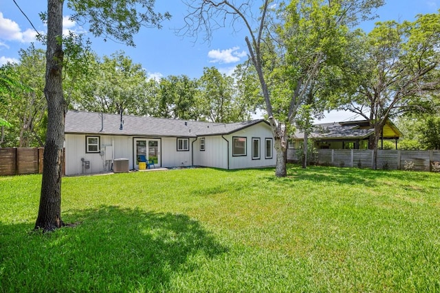 4802 Brighton Rd, Austin, TX 78745 - back of property with a fenced backyard and a shingled roof