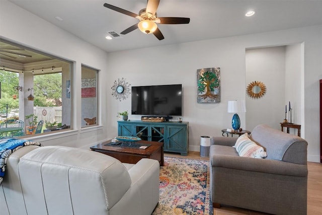653 Coyote Creek Way, Kyle, TX 78640 - living area featuring light wood finished floors, a ceiling fan, recessed lighting, and baseboards