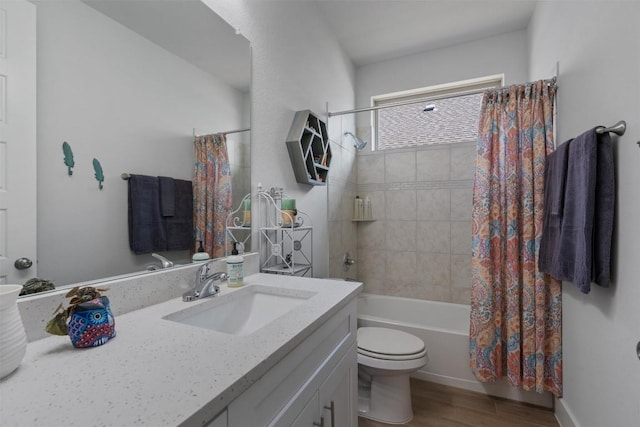 653 Coyote Creek Way, Kyle, TX 78640 - full bath featuring toilet, vanity, wood finished floors, and shower / bath combination with curtain