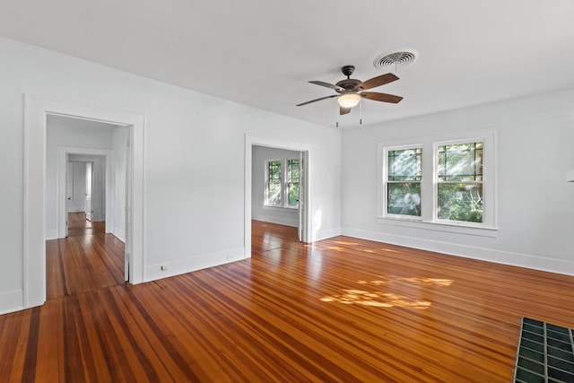 3406 Duval St, Austin, TX 78705 - spare room with baseboards, a ceiling fan, and wood finished floors