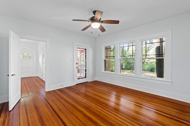 3406 Duval St, Austin, TX 78705 - spare room with baseboards, a ceiling fan, and dark wood-style flooring