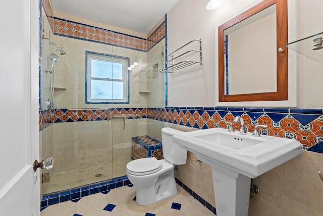 3406 Duval St, Austin, TX 78705 - full bath featuring tile walls, toilet, a stall shower, tile patterned flooring, and a wainscoted wall