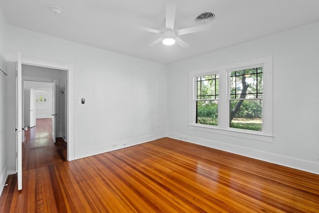3406 Duval St, Austin, TX 78705 - unfurnished room with ceiling fan, baseboards, dark wood-style flooring, and a smoke detector