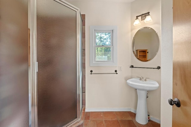 3406 Duval St, Austin, TX 78705 - bathroom featuring a shower stall, baseboards, and a sink