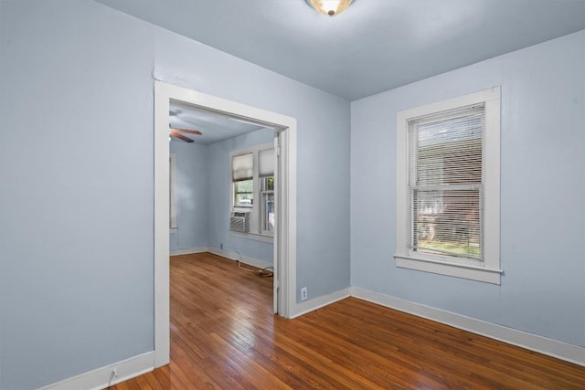 604 Harris Ave, Austin, TX 78705 - empty room featuring hardwood / wood-style floors, baseboards, a ceiling fan, and cooling unit