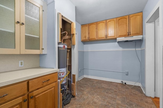 604 Harris Ave, Austin, TX 78705 - laundry area featuring baseboards and gas water heater