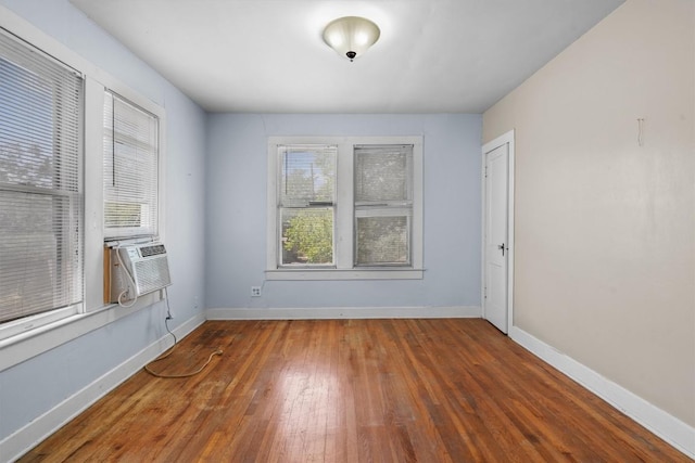 604 Harris Ave, Austin, TX 78705 - spare room featuring hardwood / wood-style floors, baseboards, and cooling unit
