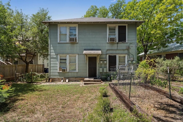 604 Harris Ave, Austin, TX 78705 - view of front of property with a vegetable garden, a shingled roof, and cooling unit