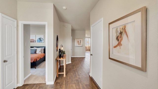 166 Caddo Bnd, Kyle, TX 78640 - hallway featuring dark wood finished floors and baseboards