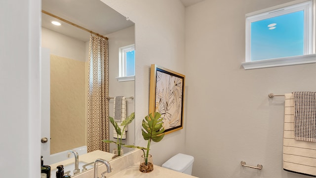 166 Caddo Bnd, Kyle, TX 78640 - bathroom with toilet and vanity