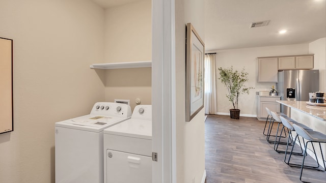 166 Caddo Bnd, Kyle, TX 78640 - laundry area with washing machine and dryer, wood finished floors, and baseboards
