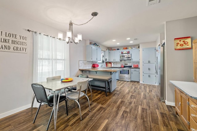3704 Del Rio Ct, Georgetown, TX 78628 - dining area featuring dark wood-style floors, a chandelier, and recessed lighting