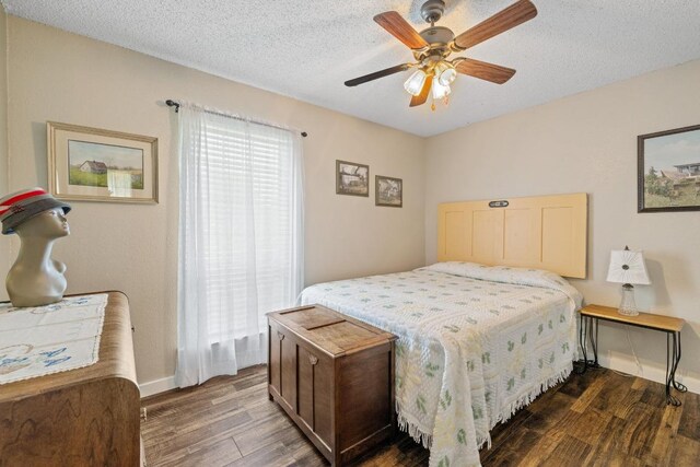 3704 Del Rio Ct, Georgetown, TX 78628 - bedroom featuring wood finished floors, a textured ceiling, and a ceiling fan