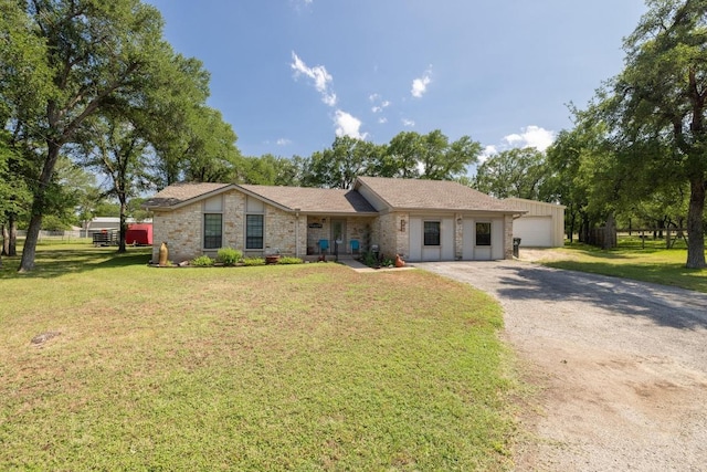3704 Del Rio Ct, Georgetown, TX 78628 - view of front facade featuring driveway, a front yard, and a garage