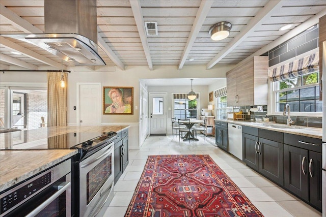 5808 Marilyn Dr, Austin, TX 78757 - kitchen featuring a sink, appliances with stainless steel finishes, island exhaust hood, pendant lighting, and light stone countertops