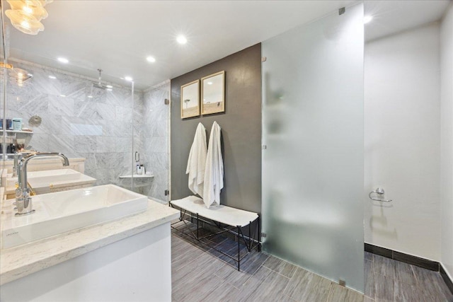 5808 Marilyn Dr, Austin, TX 78757 - full bathroom featuring an enclosed shower, recessed lighting, wood tiled floors, and double vanity