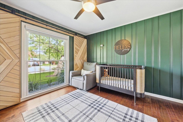 5808 Marilyn Dr, Austin, TX 78757 - bedroom with wood finished floors, ornamental molding, and ceiling fan