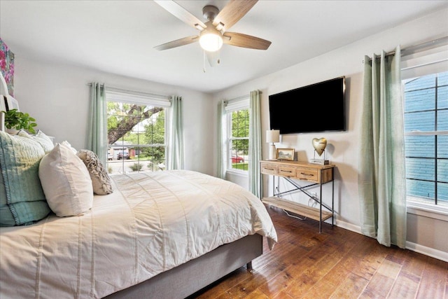 5808 Marilyn Dr, Austin, TX 78757 - bedroom featuring hardwood / wood-style flooring, baseboards, and a ceiling fan