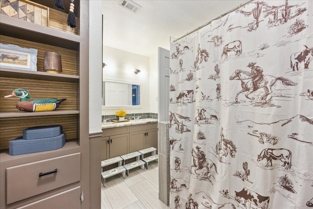 5808 Marilyn Dr, Austin, TX 78757 - full bathroom featuring vanity and a shower with curtain