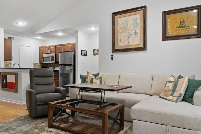 3601 Menchaca Rd Unit 215, Austin, TX 78704 - living room featuring lofted ceiling, light wood-style flooring, and recessed lighting