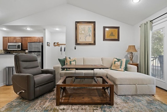 3601 Menchaca Rd Unit 215, Austin, TX 78704 - living room with vaulted ceiling, light wood-type flooring, and recessed lighting