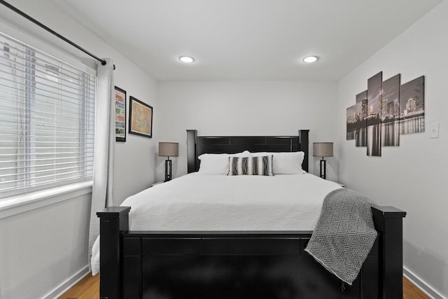 3601 Menchaca Rd Unit 215, Austin, TX 78704 - bedroom with light wood-type flooring, baseboards, and recessed lighting