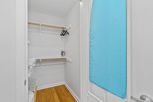 3601 Menchaca Rd Unit 215, Austin, TX 78704 - walk in closet with wood finished floors