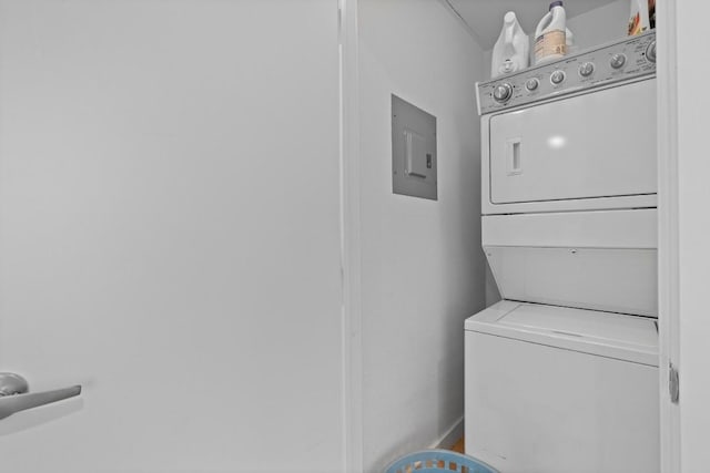 3601 Menchaca Rd Unit 215, Austin, TX 78704 - laundry area featuring stacked washer and clothes dryer and electric panel