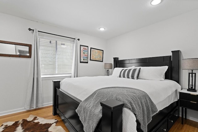 3601 Menchaca Rd Unit 215, Austin, TX 78704 - bedroom featuring light wood-type flooring, baseboards, and recessed lighting