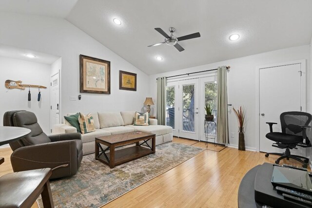 3601 Menchaca Rd Unit 215, Austin, TX 78704 - living room with lofted ceiling, ceiling fan, wood finished floors, recessed lighting, and french doors