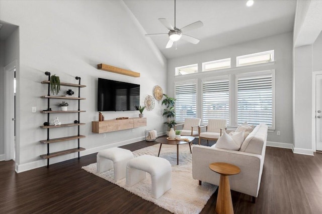 8103 Chrysler Bnd, Austin, TX 78744 - living room featuring ceiling fan, wood finished floors, healthy amount of natural light, baseboards, and high vaulted ceiling