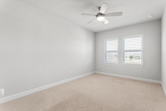 8103 Chrysler Bnd, Austin, TX 78744 - empty room with light carpet, baseboards, and a ceiling fan