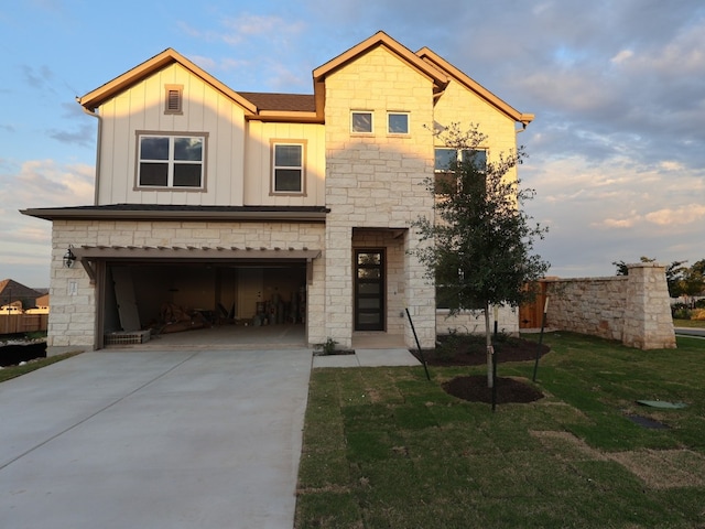 1200 Snowdrop Ln, Georgetown, TX 78628 - view of front facade featuring board and batten siding, a front lawn, an attached garage, stone siding, and concrete driveway