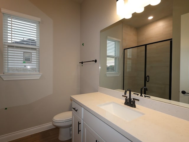 1200 Snowdrop Dr, Georgetown, TX 78628 - full bath with wood finished floors, vanity, a stall shower, and recessed lighting