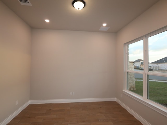 1200 Snowdrop Dr, Georgetown, TX 78628 - empty room featuring wood finished floors and recessed lighting