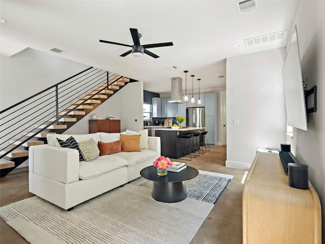 2910 Garwood St Unit A, Austin, TX 78702 - living room with stairs, ceiling fan, baseboards, and recessed lighting
