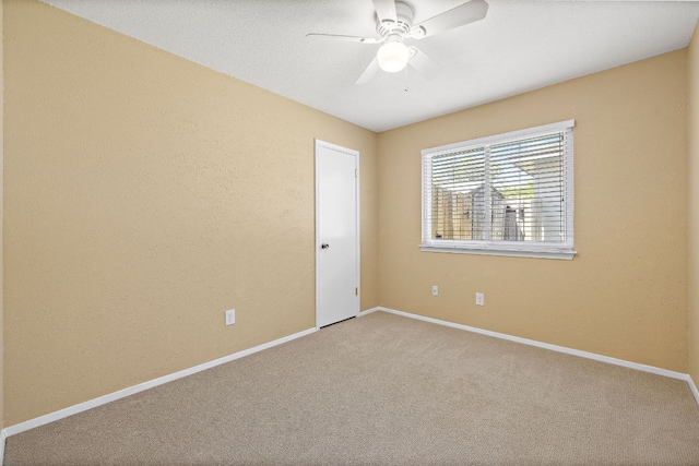 11611 Prairie Hen Ln, Austin, TX 78758 - spare room featuring carpet, ceiling fan, and baseboards