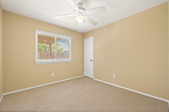 11611 Prairie Hen Ln, Austin, TX 78758 - unfurnished room with light colored carpet, baseboards, and ceiling fan