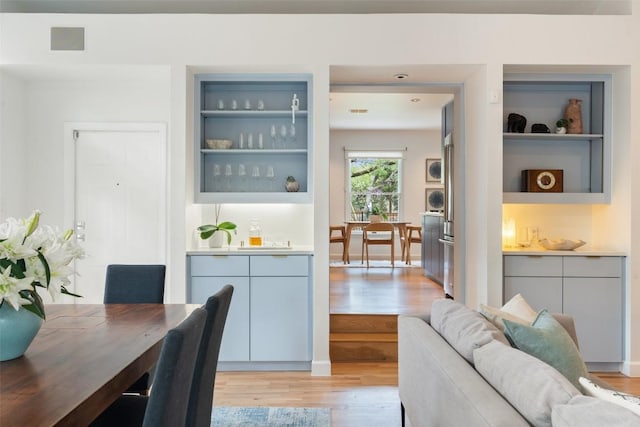 2103 W 10th St, Austin, TX 78703 - dining space with light wood-style flooring and built in shelves