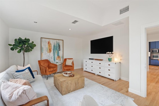 2103 W 10th St, Austin, TX 78703 - living area with light wood-style flooring, baseboards, and recessed lighting