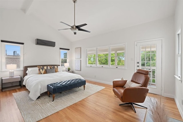 2103 W 10th St, Austin, TX 78703 - bedroom with a wall unit AC, access to outside, high vaulted ceiling, light wood-type flooring, and baseboards