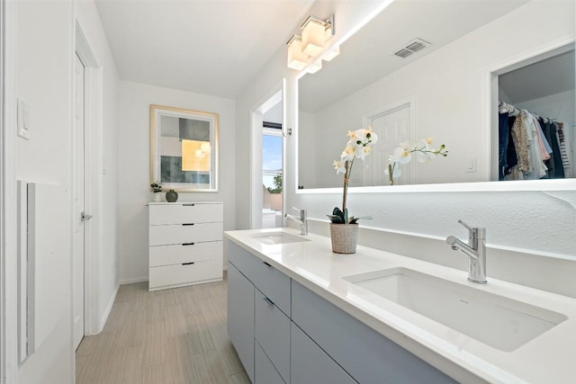 2103 W 10th St, Austin, TX 78703 - full bath with double vanity, a spacious closet, and baseboards
