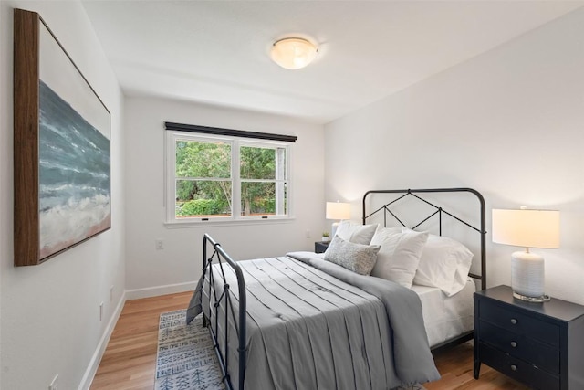 2103 W 10th St, Austin, TX 78703 - bedroom featuring light wood finished floors and baseboards