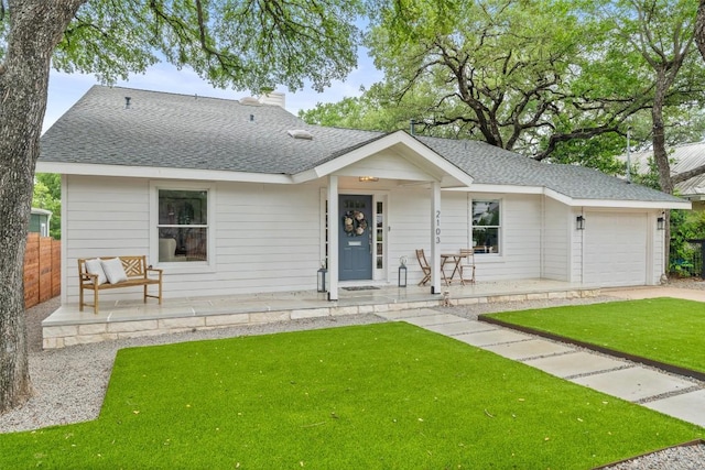 2103 W 10th St, Austin, TX 78703 - view of front facade with a porch, a garage, a shingled roof, and a chimney