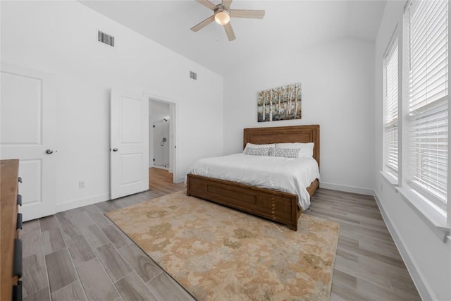 6408 Empresa Dr, Austin, TX 78738 - bedroom with high vaulted ceiling, baseboards, wood finished floors, and ceiling fan