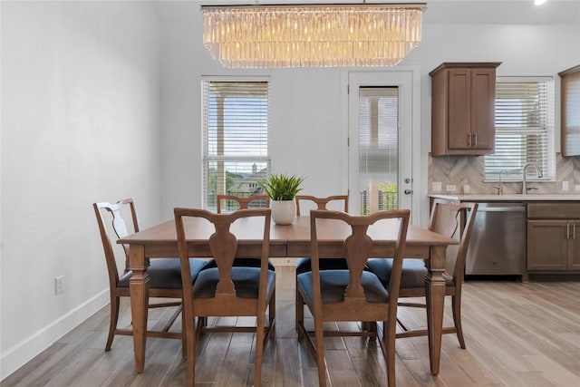 6408 Empresa Dr, Austin, TX 78738 - dining room with light wood-style flooring and baseboards