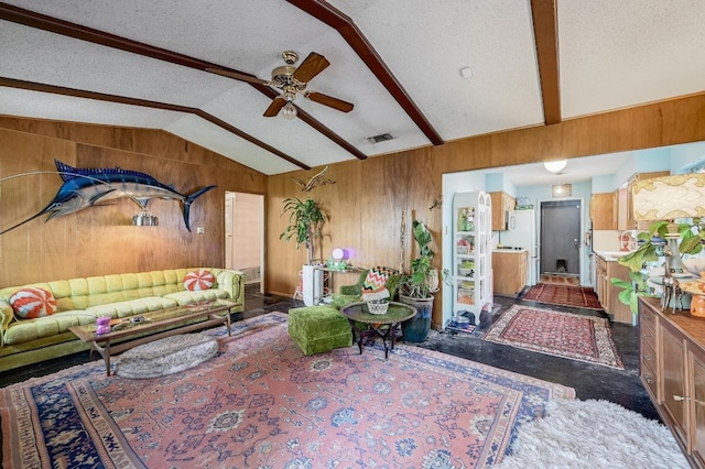 3304 Whitepine Dr, Austin, TX 78757 - living room with lofted ceiling, a ceiling fan, wooden walls, and a textured ceiling