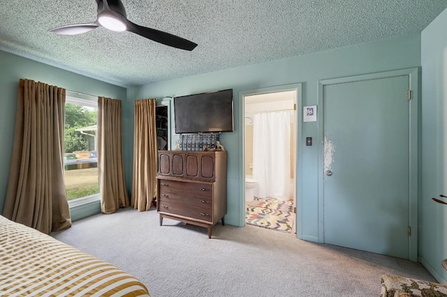 3304 Whitepine Dr, Austin, TX 78757 - carpeted bedroom featuring a textured ceiling, ensuite bathroom, and ceiling fan