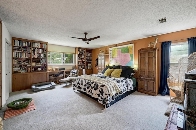 3304 Whitepine Dr, Austin, TX 78757 - bedroom with carpet floors, a textured ceiling, and ceiling fan