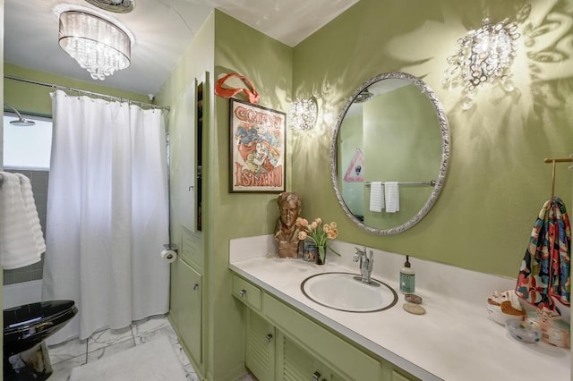 3304 Whitepine Dr, Austin, TX 78757 - full bath with marble finish floors, vanity, a chandelier, and a shower with shower curtain